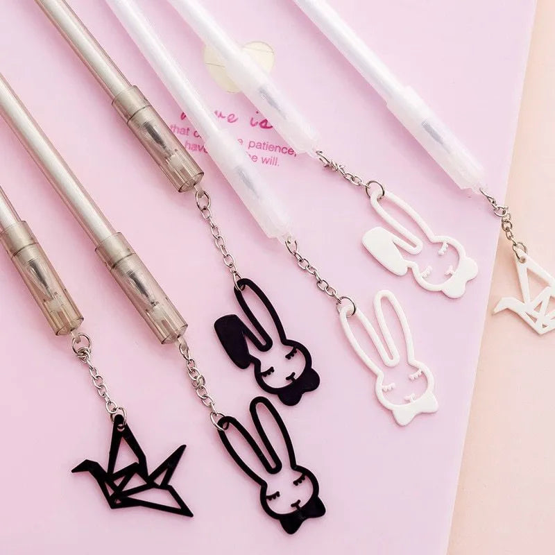 Plastic gel pen with decorative paper crane pendant and 0.38mm fine tip, shown at 17cm length.