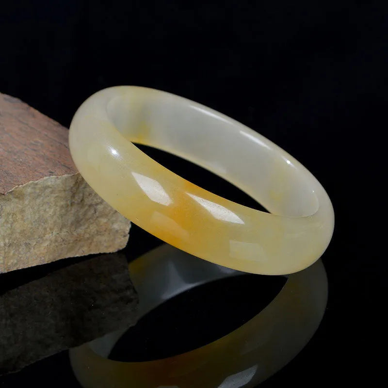 Traditional Chinese jade bracelet with polished finish in multiple sizes from 54mm to 62mm