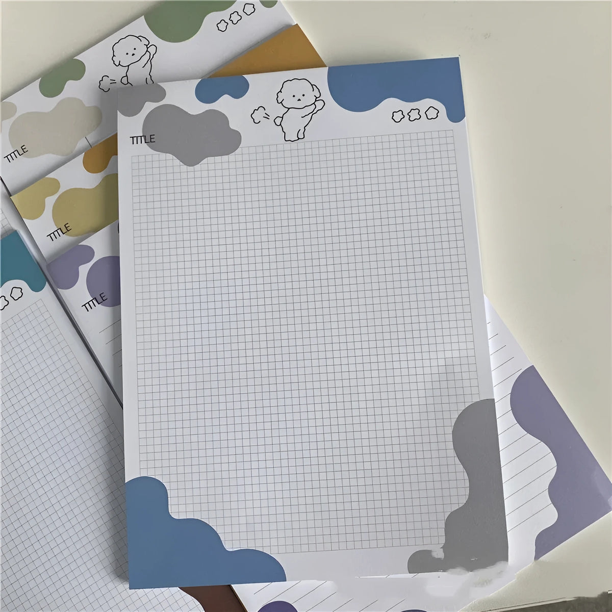 B5 sticky note pad with dog illustration cover, showing one sheet peeled back to reveal adhesive.