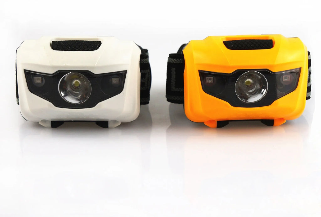 Cat eye 2nd generation outdoor headlight in black with white and red LEDs, shown as a head-mounted light.
