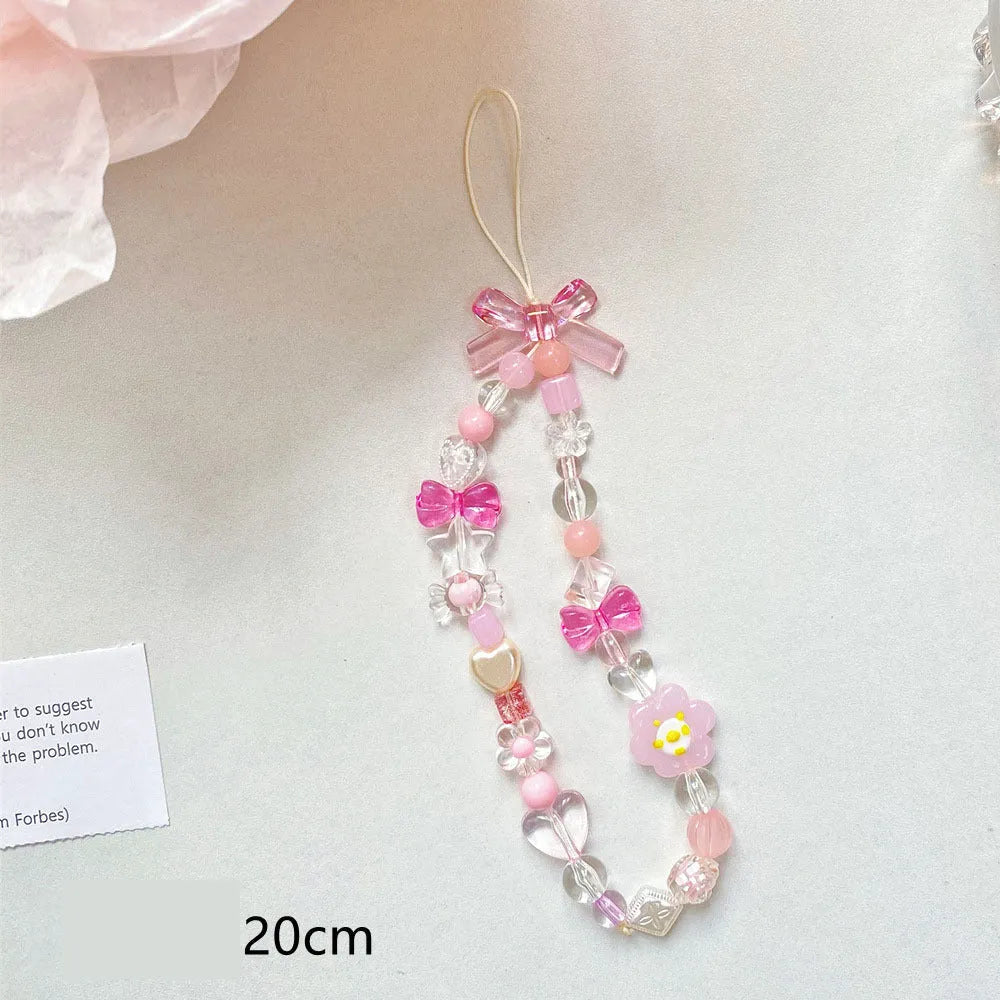 Beaded flower phone lanyard with floral charm on adjustable rope strap in blue, pink, or yellow