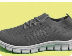 Women's casual flat shoes in beige with mesh upper and front-tie laces on a low EVA sole.