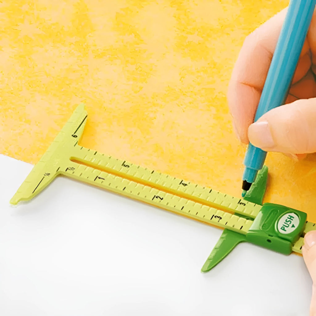 Clear patchwork rulers in two sizes (21x8cm and 33x9cm) on a fabric cutting mat with a rotary cutter