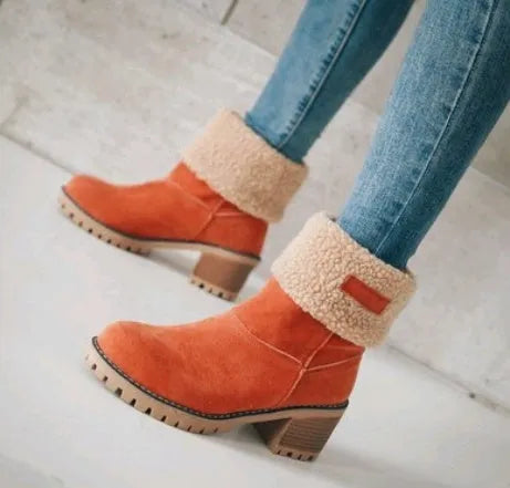Women's mid-calf suede snow boot with thick heel on a waterproof platform.