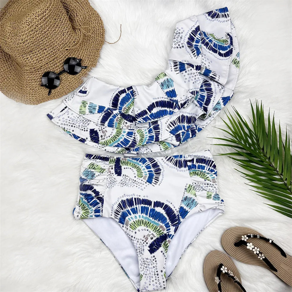 White one-shoulder swimsuit with double-layer lotus leaf skirt and high-leg split design
