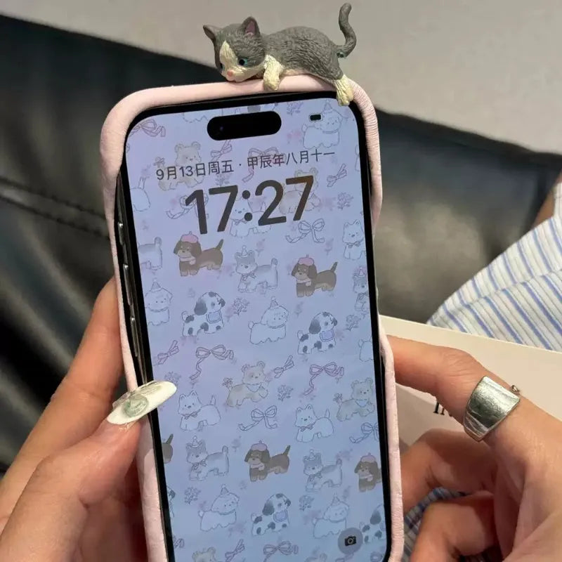 Pink satin texture iPhone case with three-dimensional gray kitten design for drop protection