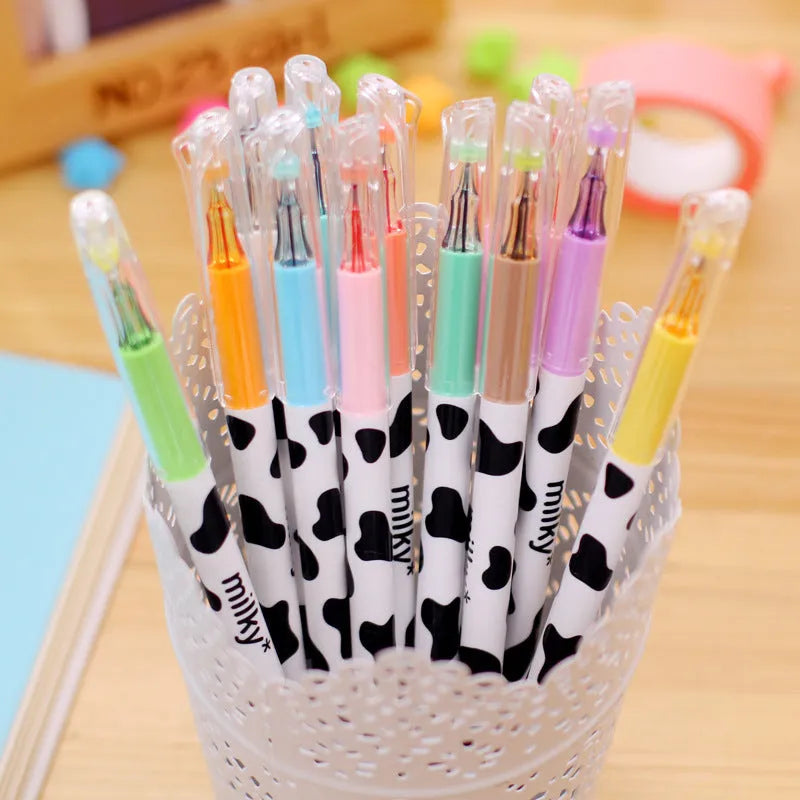 Pack of twelve assorted colour gel pens with 0.38mm fine tips and plastic cow print design barrels.