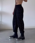 Men's plaid trousers with apron detailing in cotton polyester blend fabric