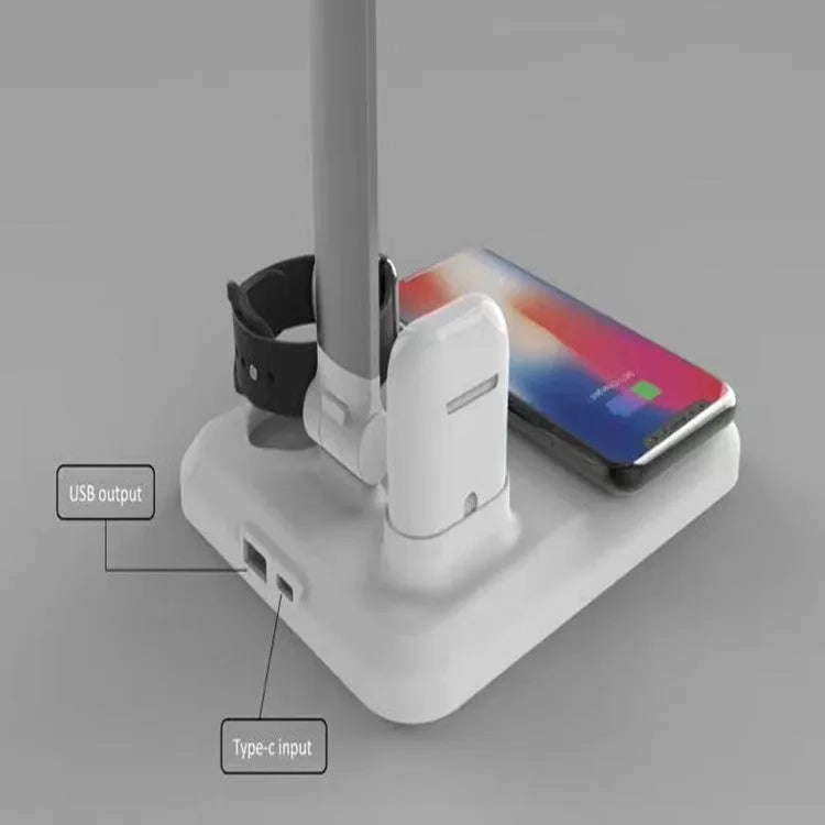 Black 4-in-1 LED desk lamp with adjustable arm and integrated wireless charging station on base