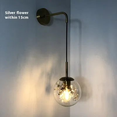 Modern glass wall-mounted bedside lamp in gold or silver finish, shown in 15cm and 20cm size options.