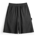 Cement grey loose fit sports shorts with straight leg cut and elastic waistband