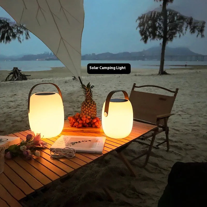 White plastic solar garden ambience light with IP65 rating, USB charging, shown in 18x27cm and 21x31cm sizes