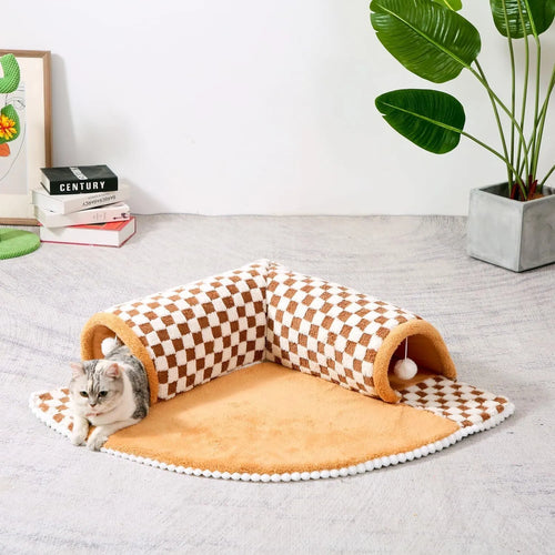 Fan-shaped plush pet bed with central play tunnel in plaid design, shown in coffee colour.
