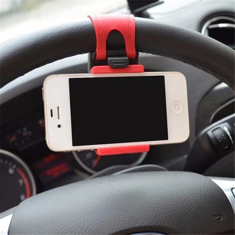 Black steering wheel phone clip mount holding smartphone with soft silicone padding visible