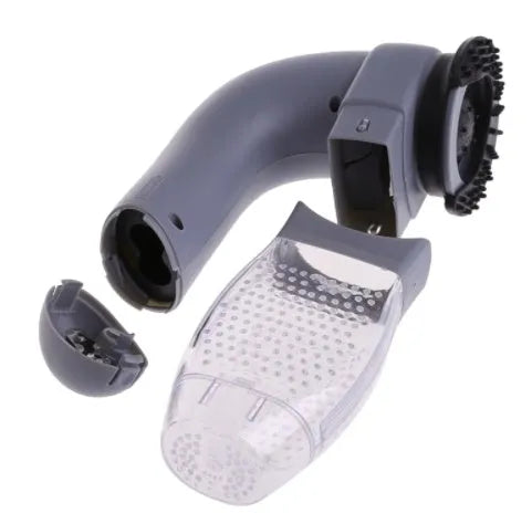 Grey portable pet hair vacuum cleaner with soft rubber grooming head on a fabric sofa