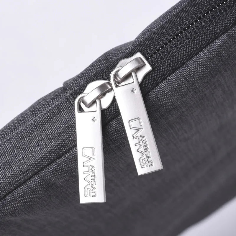Slim water-repellent polyester laptop sleeve in light grey or dark grey, fits 13, 14 and 15 inch laptops