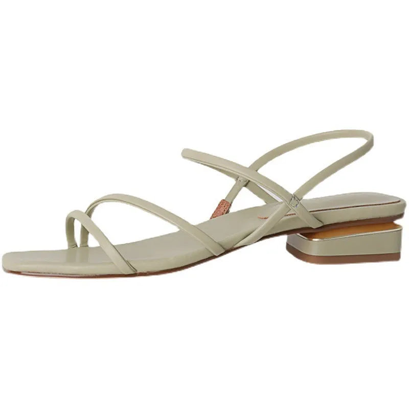 Women's flat beige Roman sandals with multiple straps and a square open toe.
