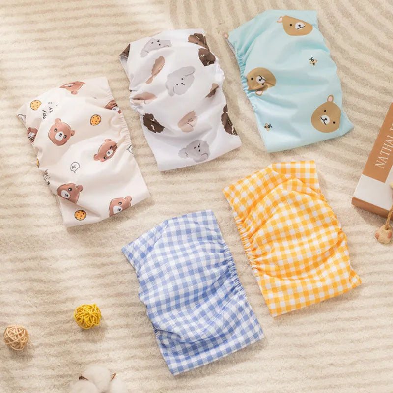 Reusable male dog diaper belly band in cartoon bone paw print pattern with fastener tape