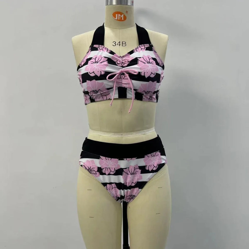 Black women's bikini with covered belly and split style for swimming.