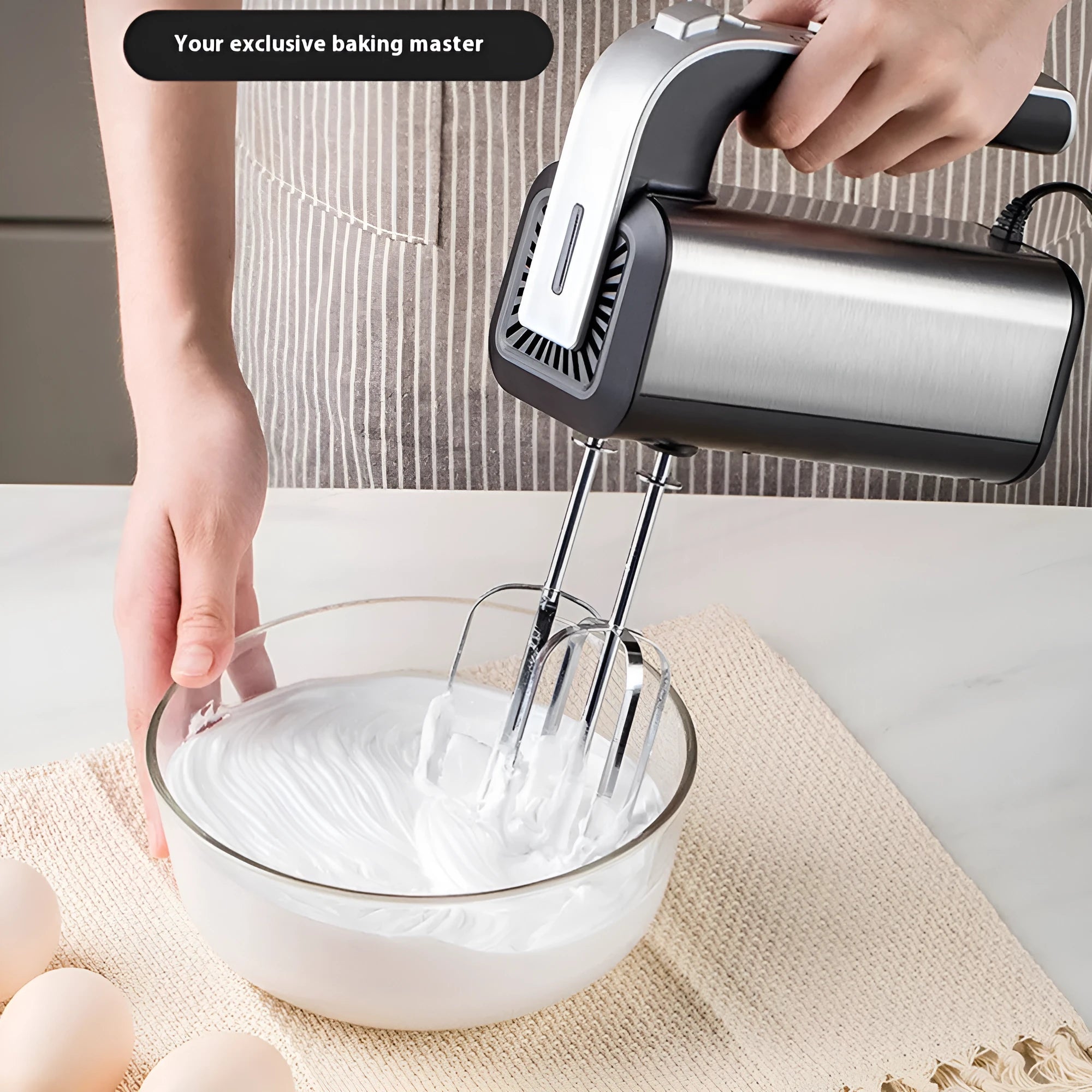 Silver handheld electric whisk with five speed settings and stainless steel beaters