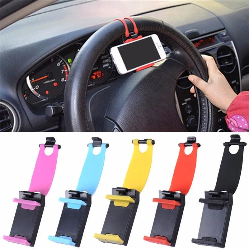 Black steering wheel phone clip mount holding smartphone with soft silicone padding visible