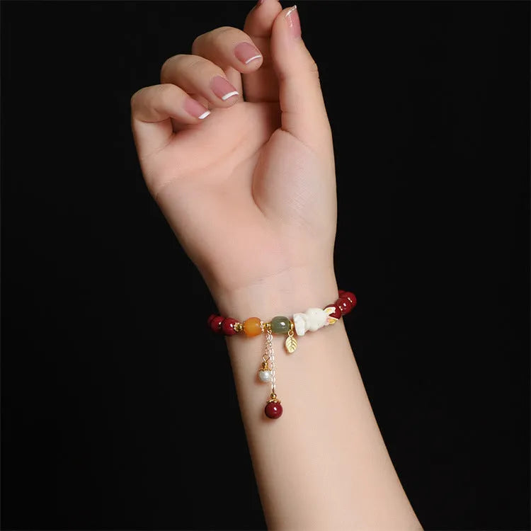 Tian Yu natural cinnabar bracelet with rabbit motif in traditional Chinese style
