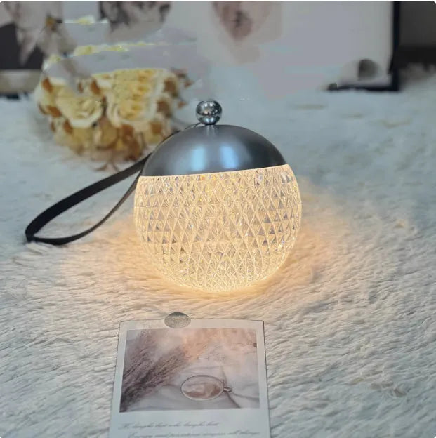 Portable dimmable desk lamp with modern minimalist design in chrome finish