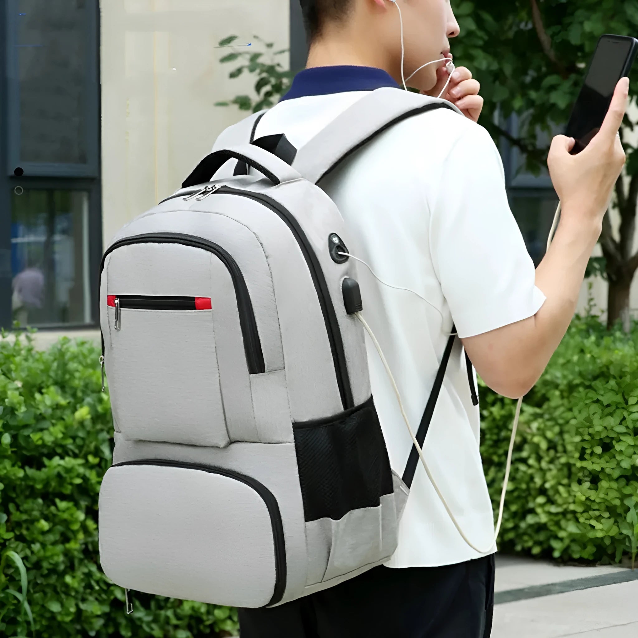Insulated Oxford cloth backpack in light grey showing curved shoulder straps and dry-wet separation compartment