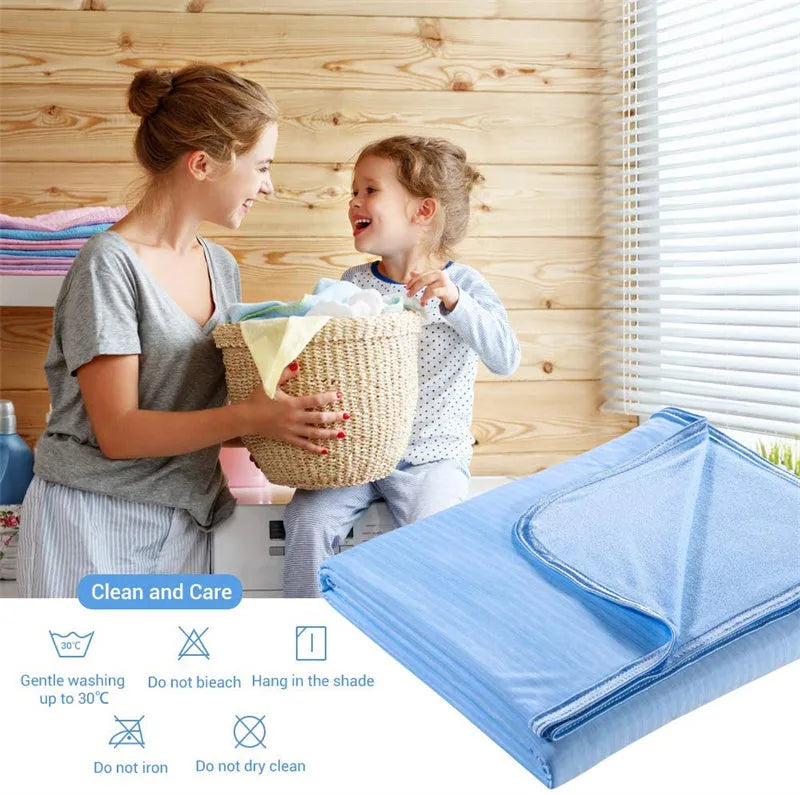 Blue cooling blanket with Japanese Q-Max fibres on a bed.