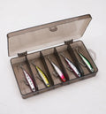 Set of five silver pencil bait fishing lures with double hooks in a storage box, showing four weight options