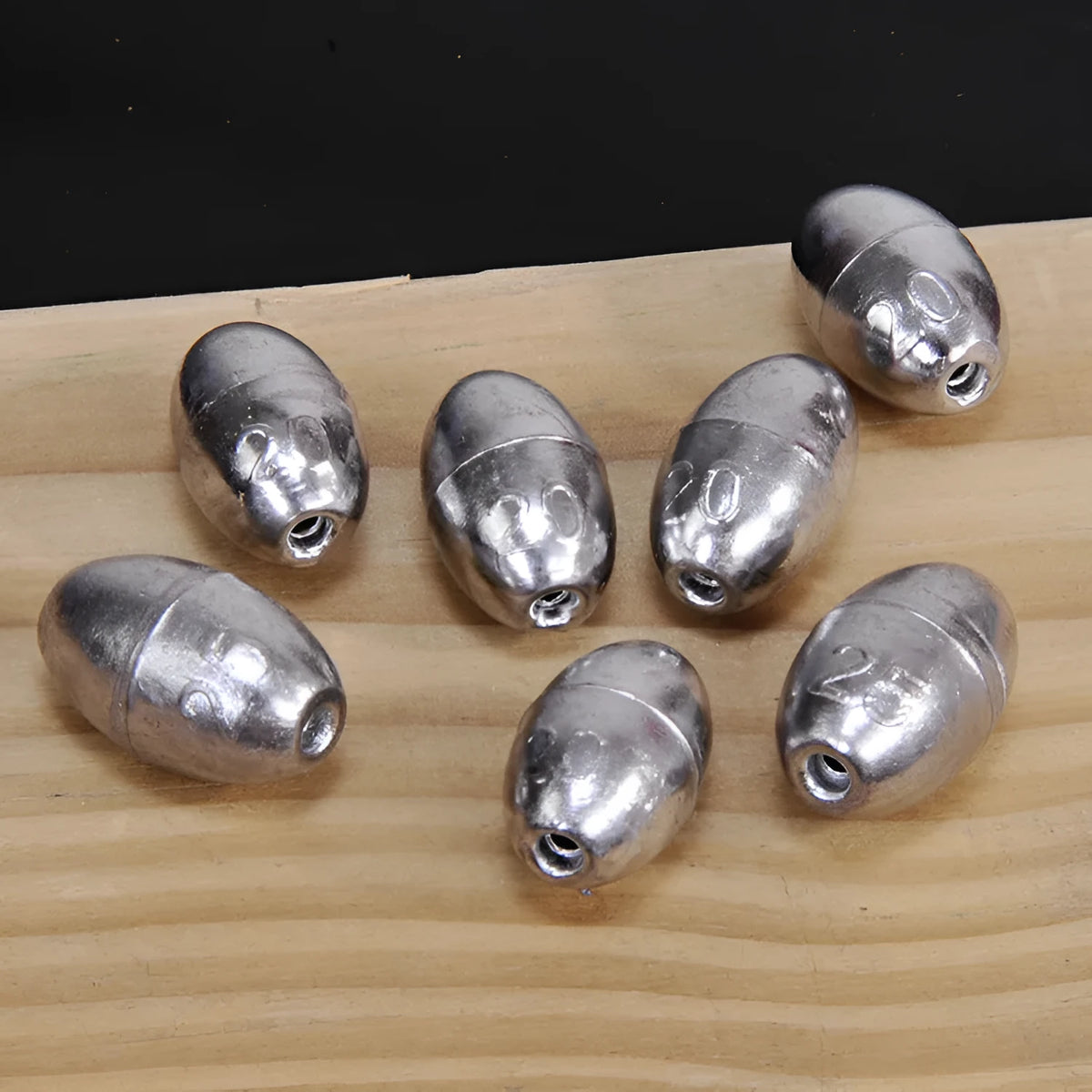 Olive-shaped lead fishing sinkers in sizes 1g to 20g, streamlined design for coarse and carp rigs