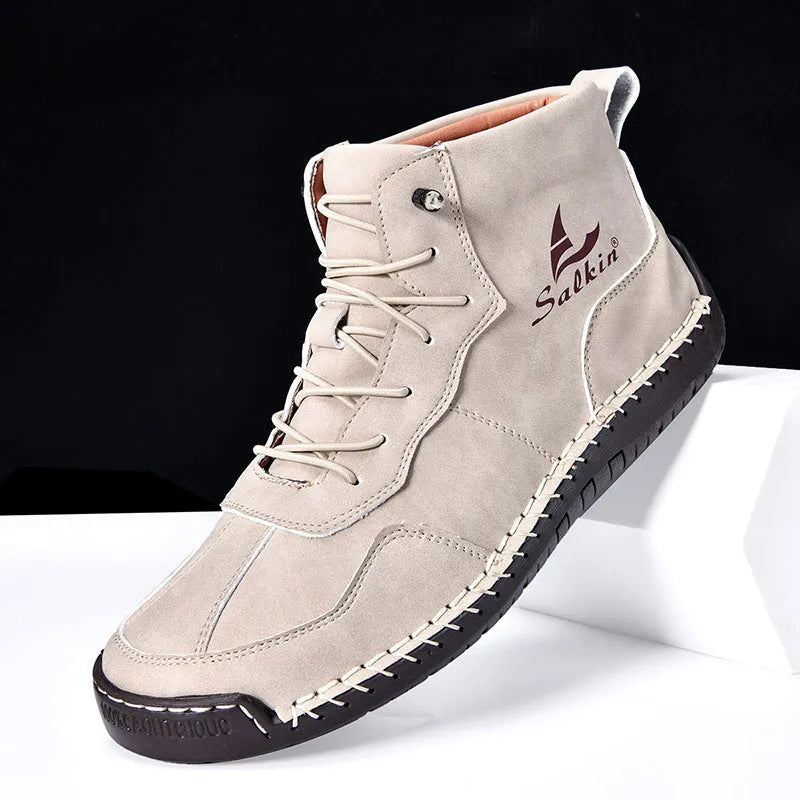 Men's beige retro-style mid-calf boots with an elastic band and flat rubber sole on a white background.