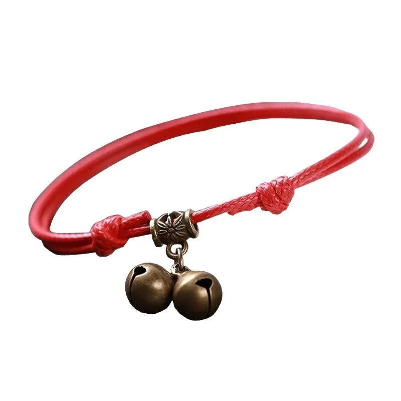 A nylon rope dog collar with a brass bell, shown in black, red, and coffee colour options.