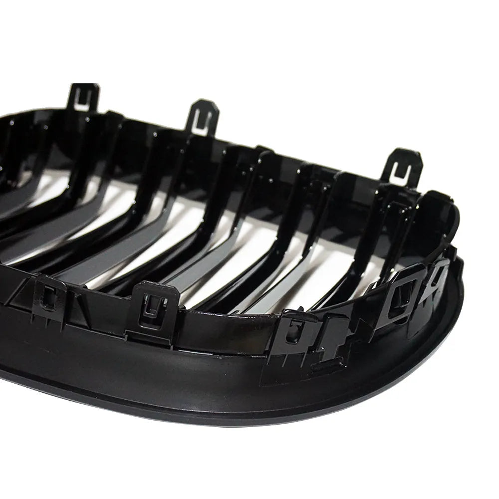Pair of ABS carbon fibre pattern grilles for a BMW 5-Series front bumper.
