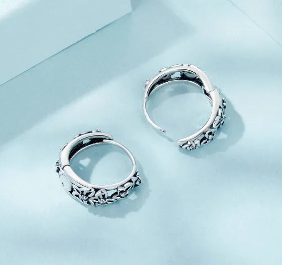 Retro hollow butterfly sterling silver earrings with zircon detail, showing 14mm height.