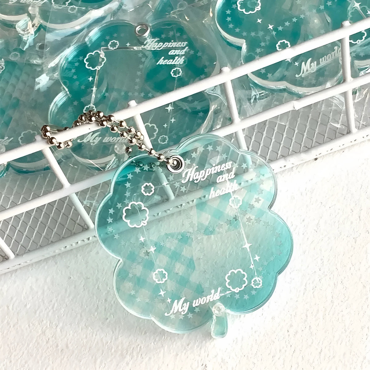 Acrylic four-leaf clover mobile phone pendant charm in blue, green, or mint colour options