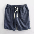 Man wearing loose-fitting cotton and linen casual shorts in a straight-leg style with an elasticated waist.
