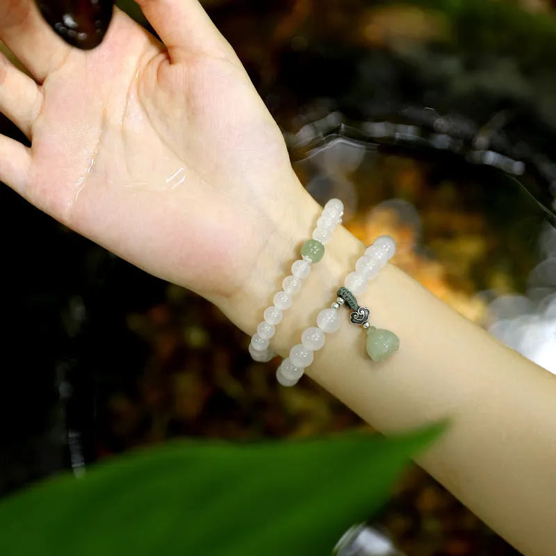 S925 silver bracelet with white agate and Hetian jade stones showing lotus geometric design
