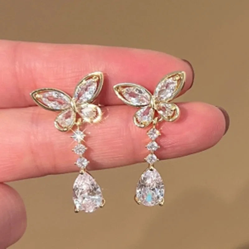 Platinum-coloured bow stud earrings with electroplated zinc alloy construction