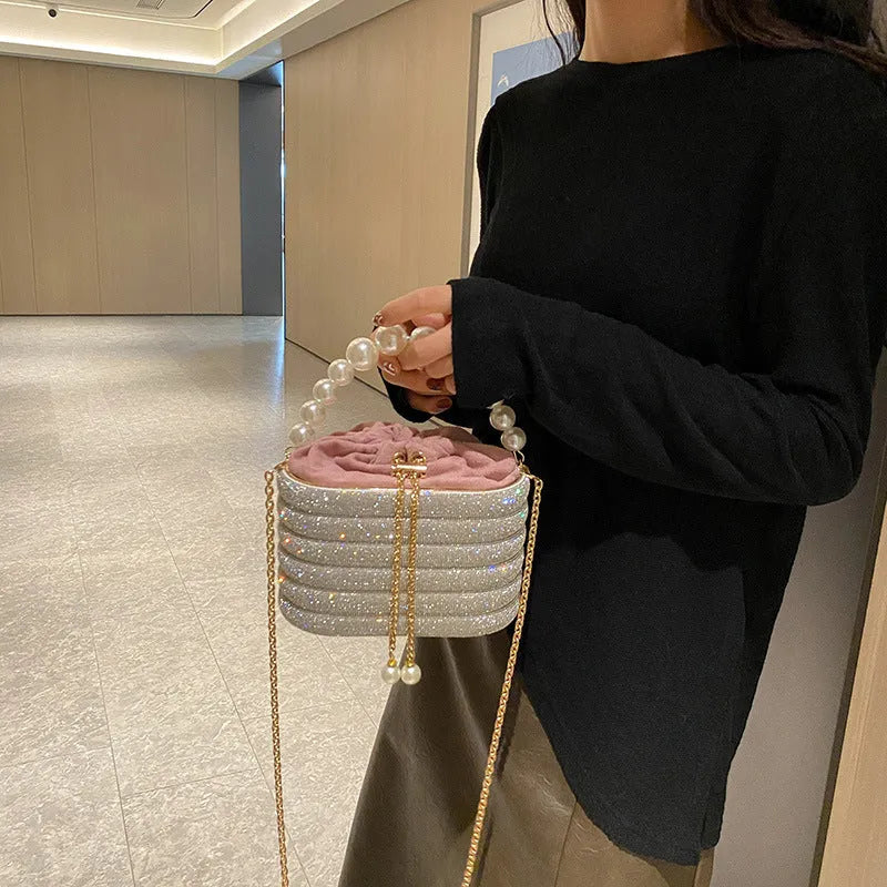 Women's retro style crossbody bag with pearl beading in soft PU, round shape with single strap.