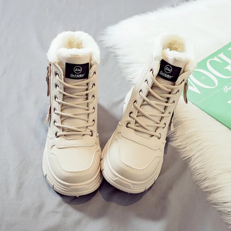 Plus size women's snow boot in black with velvet lining, showing mid-calf height and front lace-up.