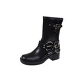 Women's black platform boots with buckle detailing showing middle calf length