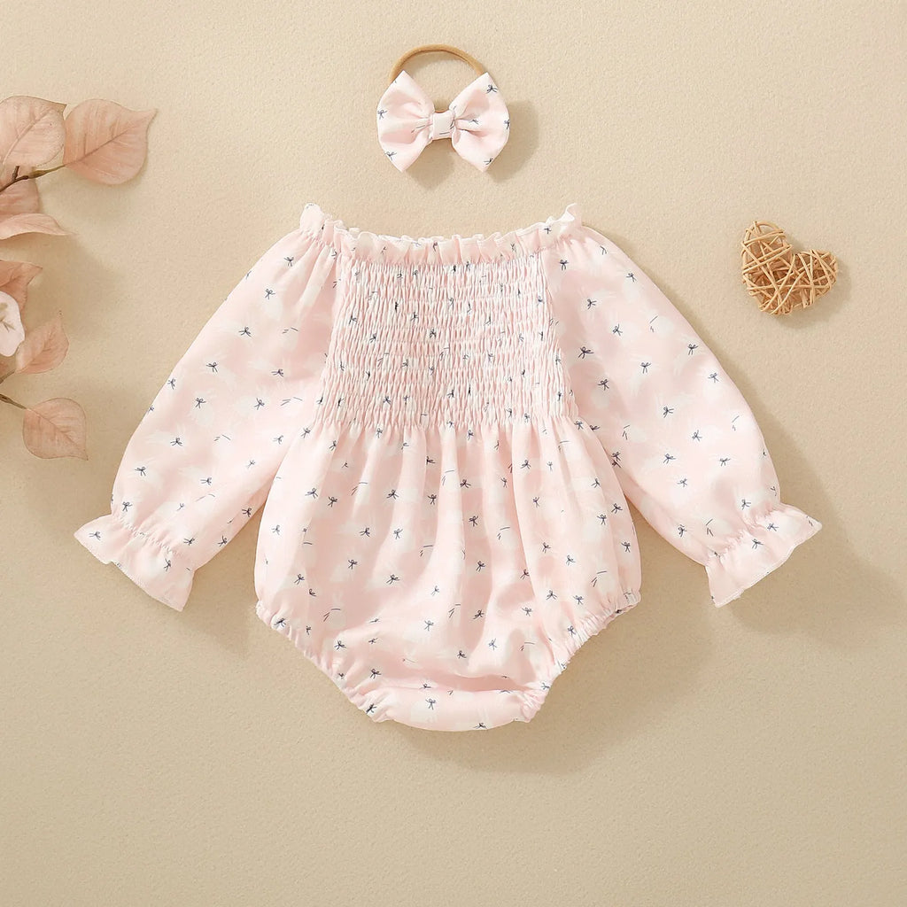 Pink infant cotton long sleeve romper with smocking and print on front for newborn baby girl