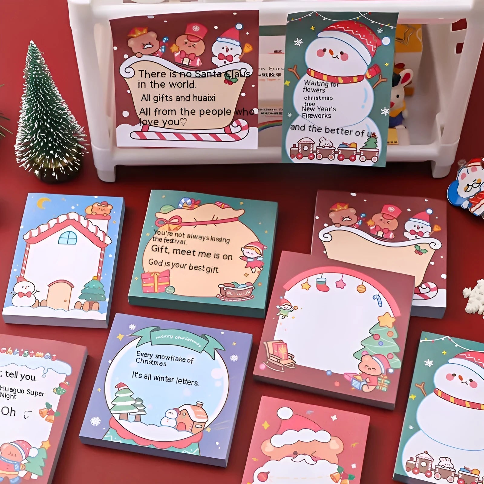 Christmas cartoon sticky notes pad with eight festive designs including elf, gift, sled, and Santa Claus