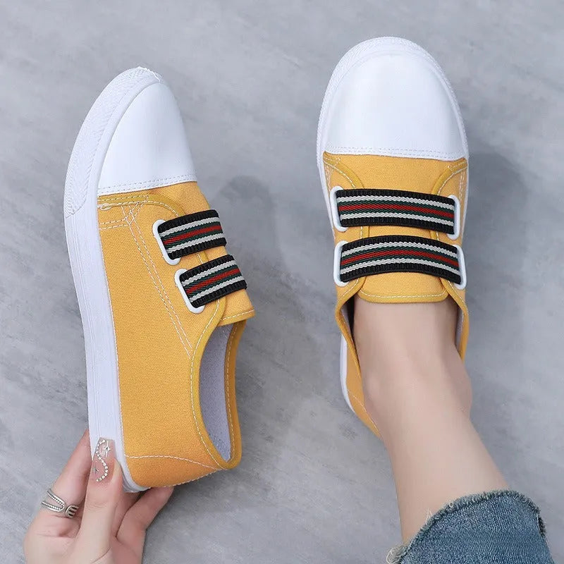 Breathable non-slip slip-on canvas sneakers with flat heel and round toe in black, white, or yellow