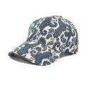 Blue polyester baseball cap with a white paisley pattern printed on the dome crown.
