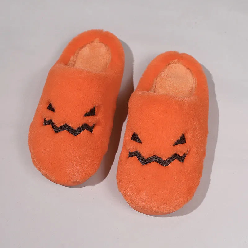 Orange Halloween pumpkin slippers with coral velvet upper and plush lining on a non-slip PVC sole.