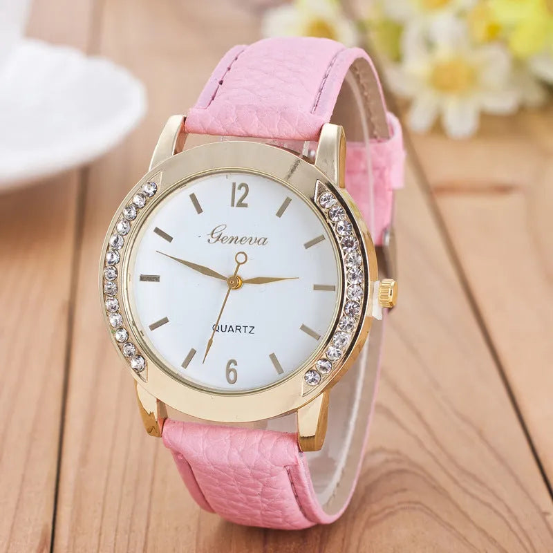 Geneva women's quartz watch with blue dial, round alloy case, and imitation leather strap on display