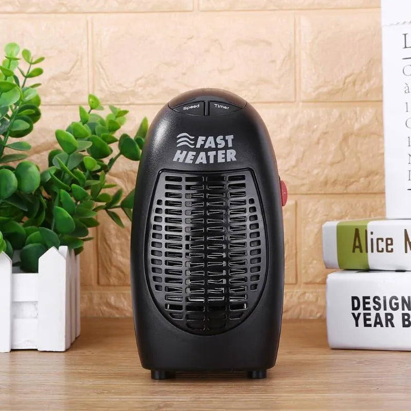 Black compact ceramic electric heater with digital display and rotating three-prong plug on a white background.