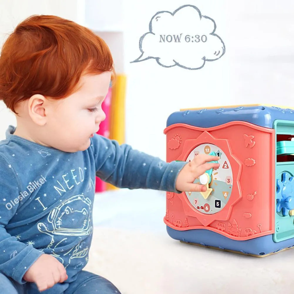 Baby hexahedron educational cube showing six sides with bead maze, clock, number tray, gears, car track, and butterfly activities